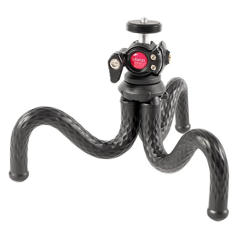 Black octopus-style flexible phone tripod with extended legs and mobile phone clip attached