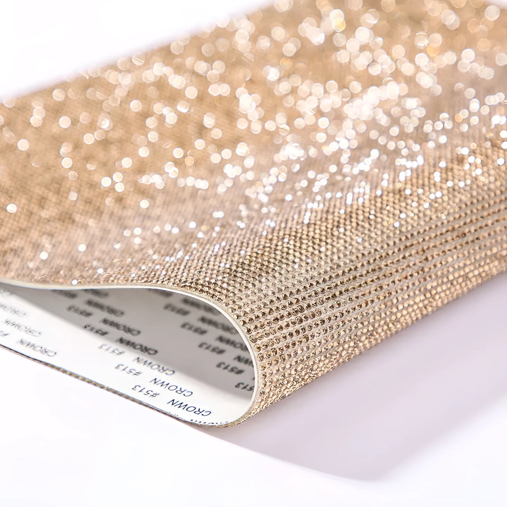 Electroplated rhinestone hot-fix sticker sheet in an eight-eye pattern on an adhesive backing.