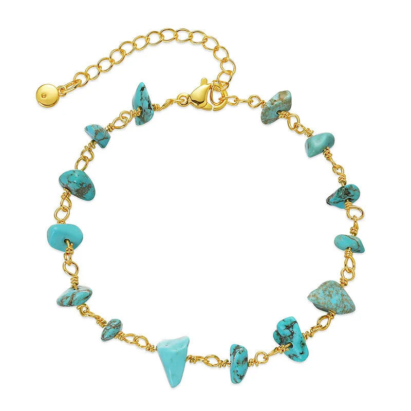Women's copper bracelet with irregular natural gravel stones and turquoise crystals in geometric design.