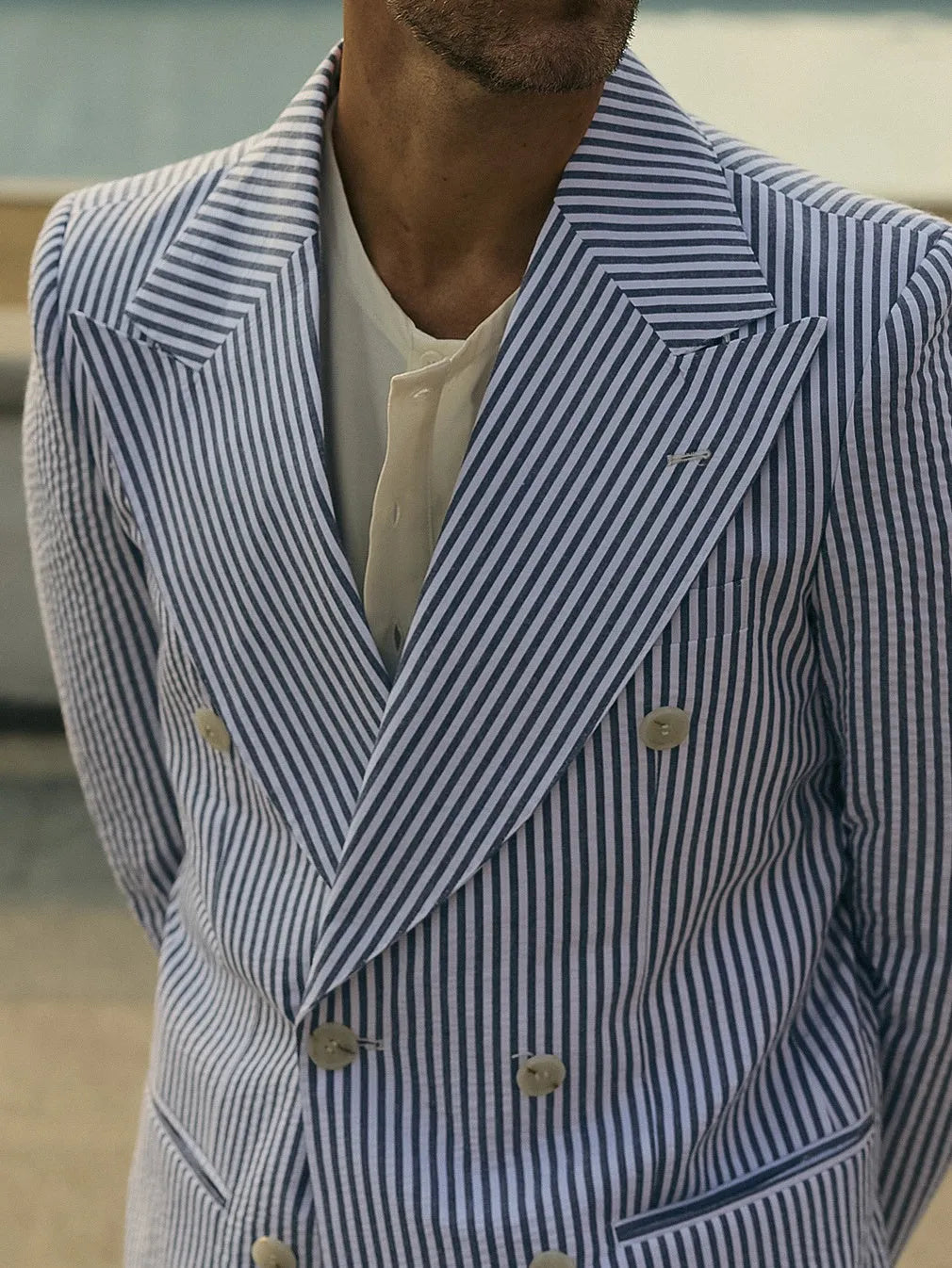 Blue and white striped polyester suit set showing blazer and matching trousers for formal wear