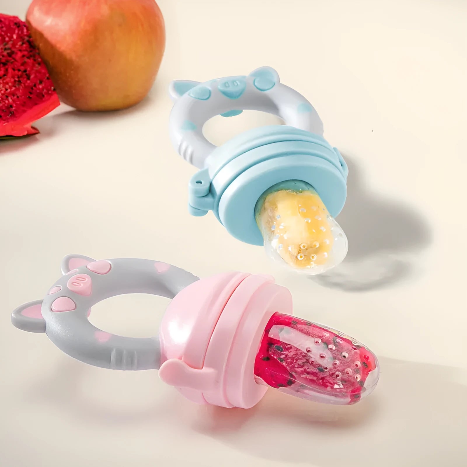 Silicone baby teether in blue, green, and pink colours with mouthpiece options