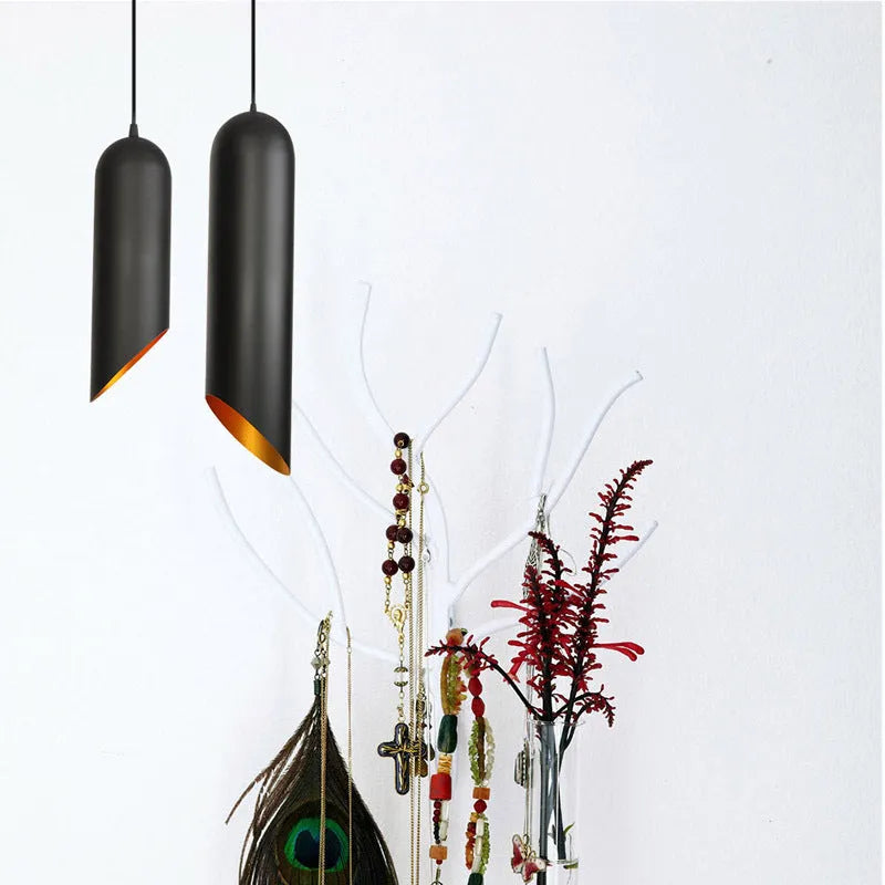 Retro iron art chandelier with matte black finish shown in bedroom setting