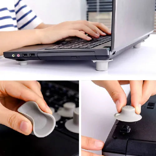 Four grey plastic laptop cooling pads, two large and two small, on a flat surface.