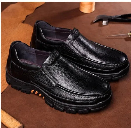 Men's black cowhide leather slip-on business casual shoes with a rubber sole.