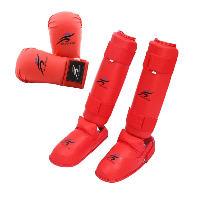 Complete martial arts protective gear set showing red boxing gloves, leg guards and helmet