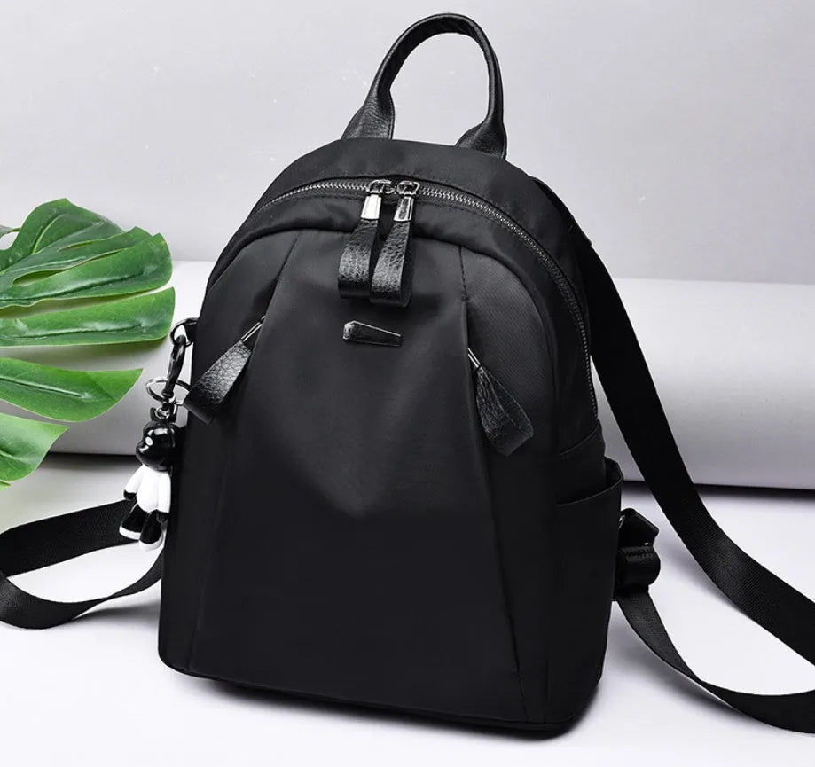 Medium square rucksack in Oxford cloth with phone compartment and double straps