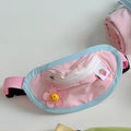 Pink and yellow backpack-style carrier bag for a small dog or cat on a person's back.