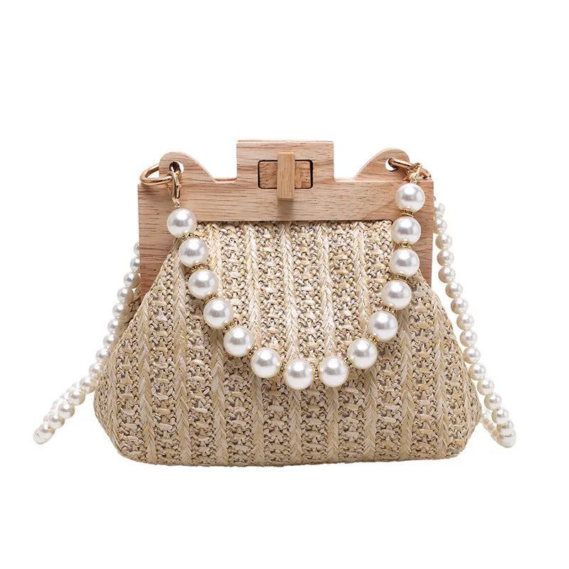 Women's straw woven shoulder bag with beach pearl chain detailing and horizontal square shape