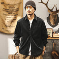 Man wearing a red loose-fit corduroy long sleeve shirt, retro casual style.