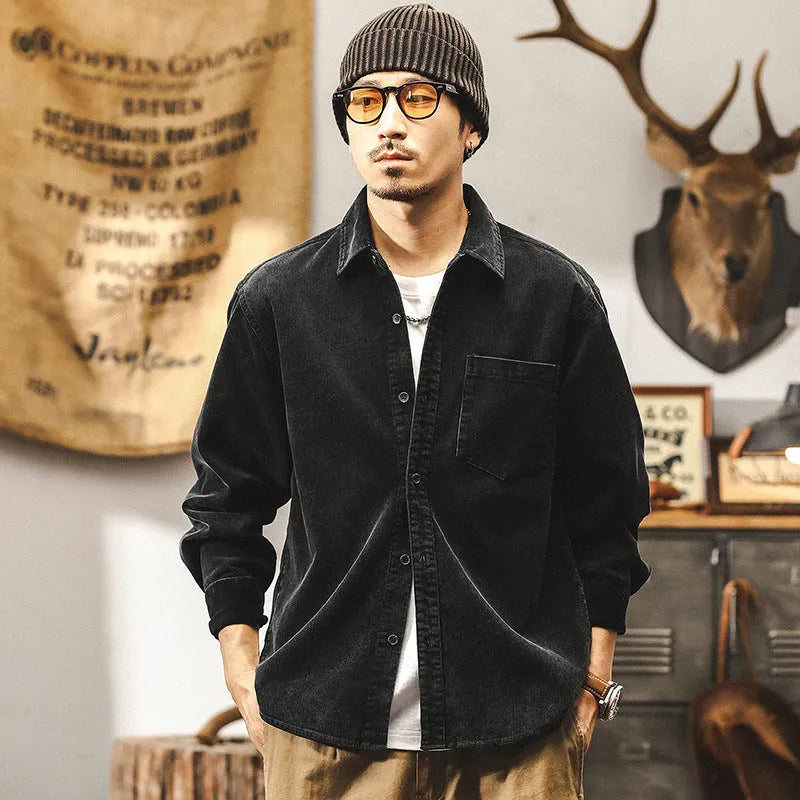 Man wearing a red loose-fit corduroy long sleeve shirt, retro casual style.