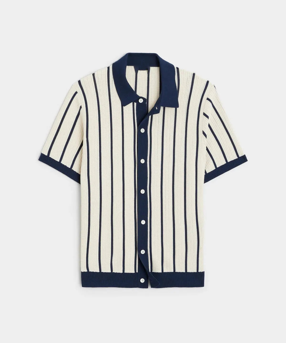 Man modelling a white short sleeve knitted top with asymmetric stripes and a lapel collar.