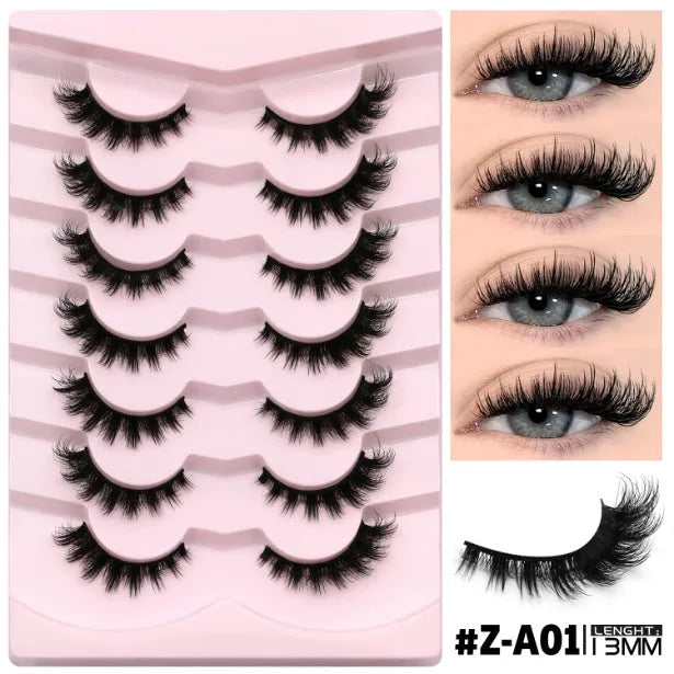Box of artificial fibre false eyelashes with thick natural long style and included adhesive glue