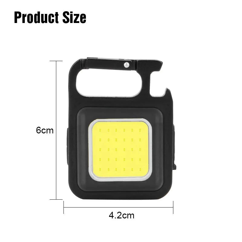Black aluminium alloy keychain light with COB LED, magnetic base, and foldable handle on keyring