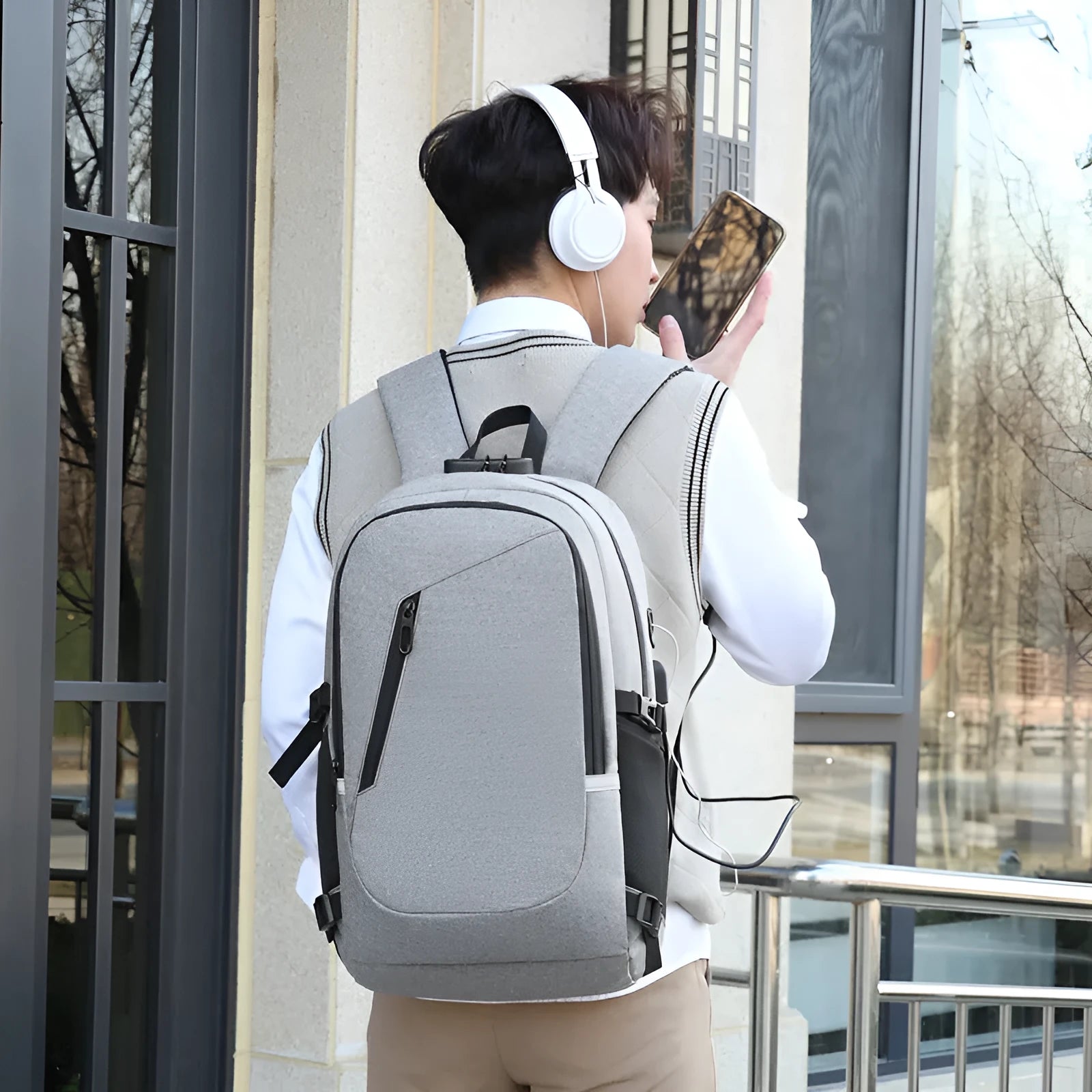 Oxford cloth computer backpack in blue colour showing front compartment and shoulder straps