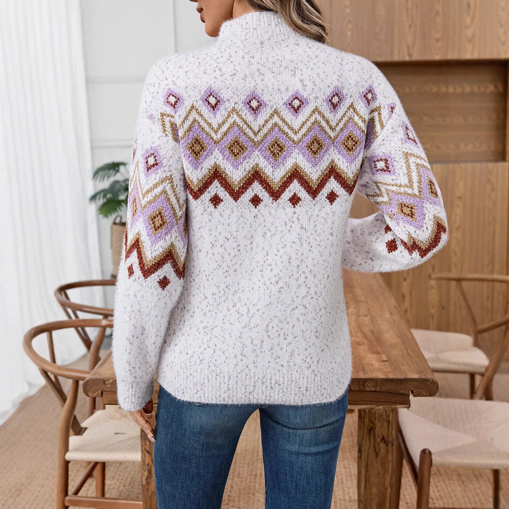 White women's loose sweater with geometric jacquard pattern and half turtleneck collar.