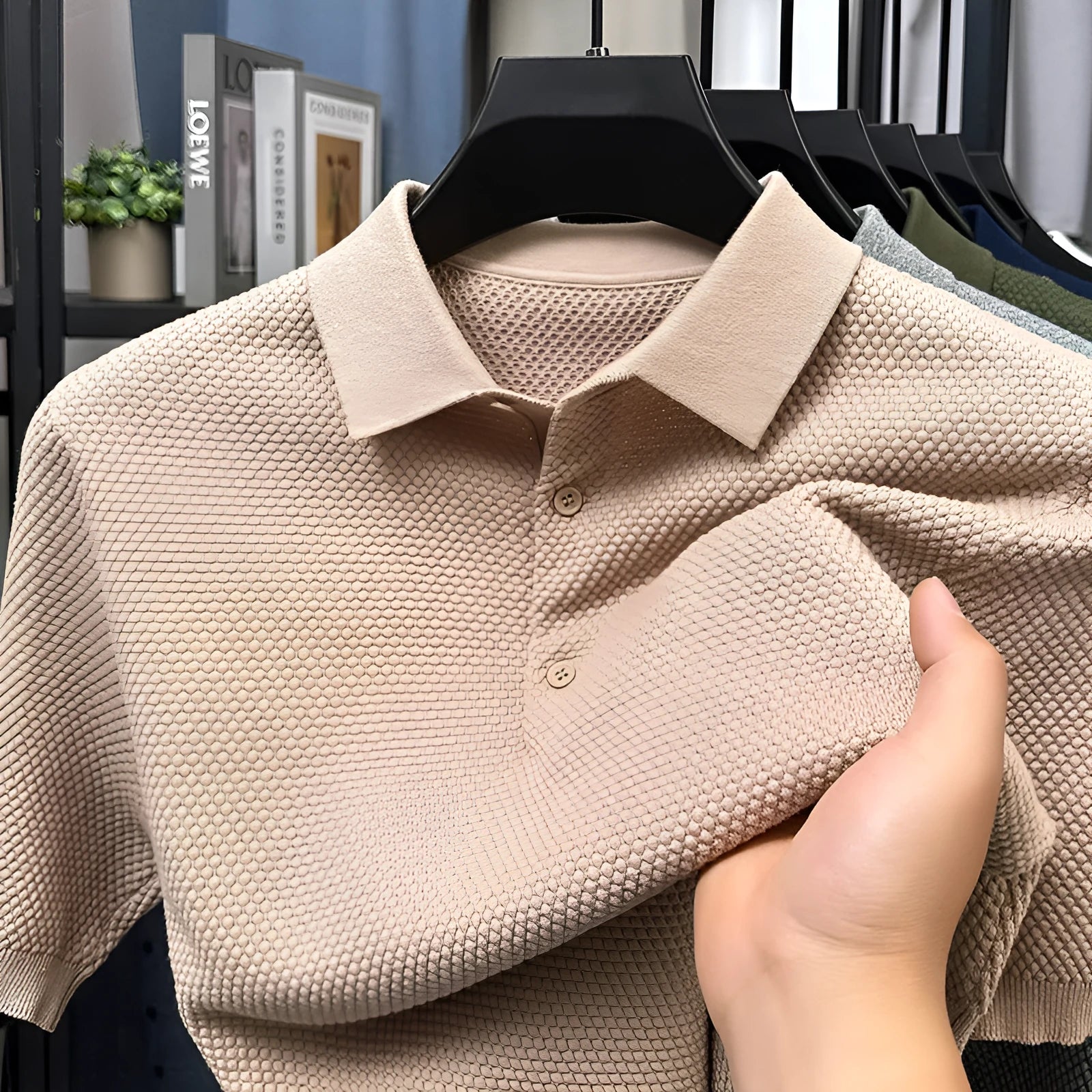 Man wearing a loose grey cotton short sleeve pullover sweater for casual leisure.