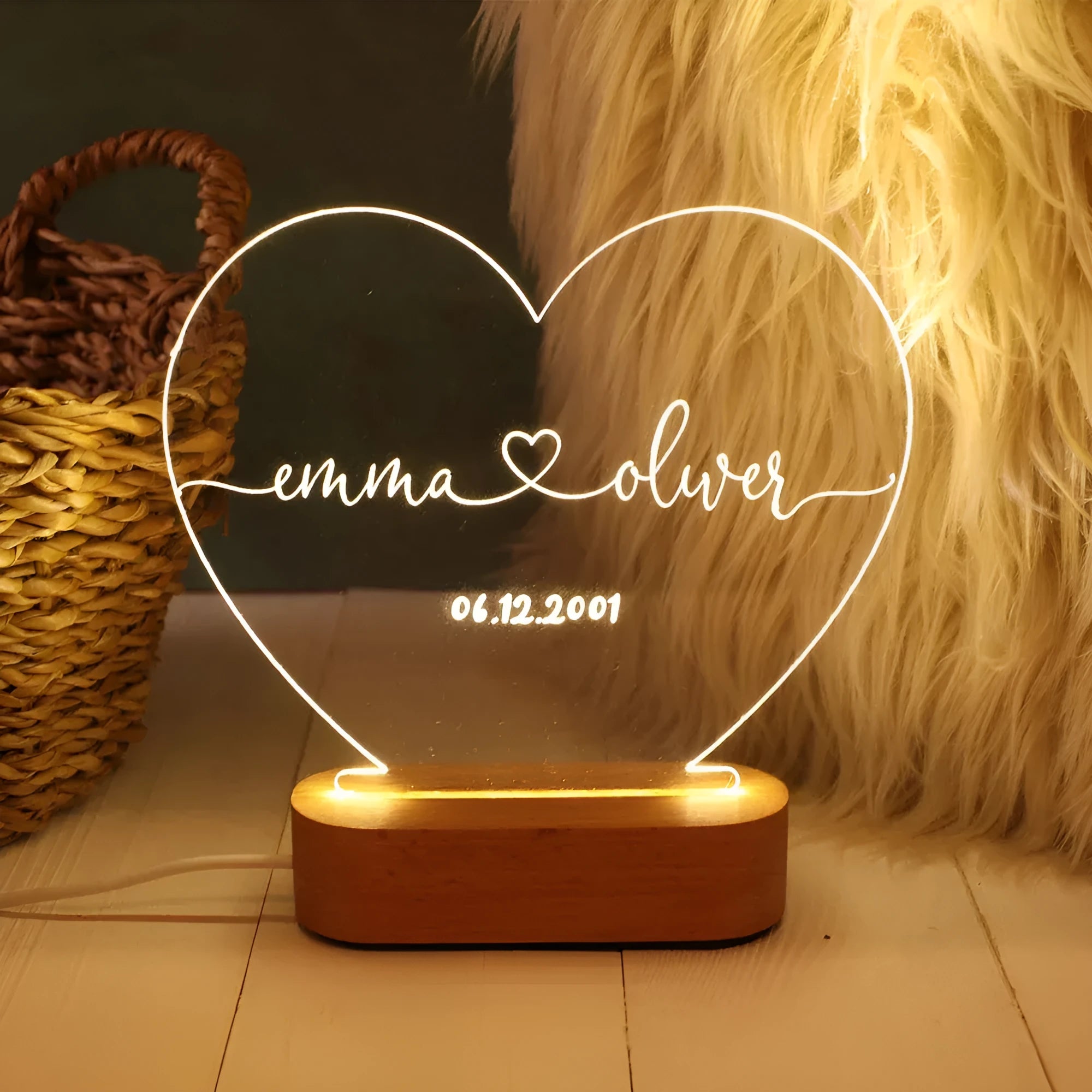Custom acrylic LED night light with personalised names and dates illuminated