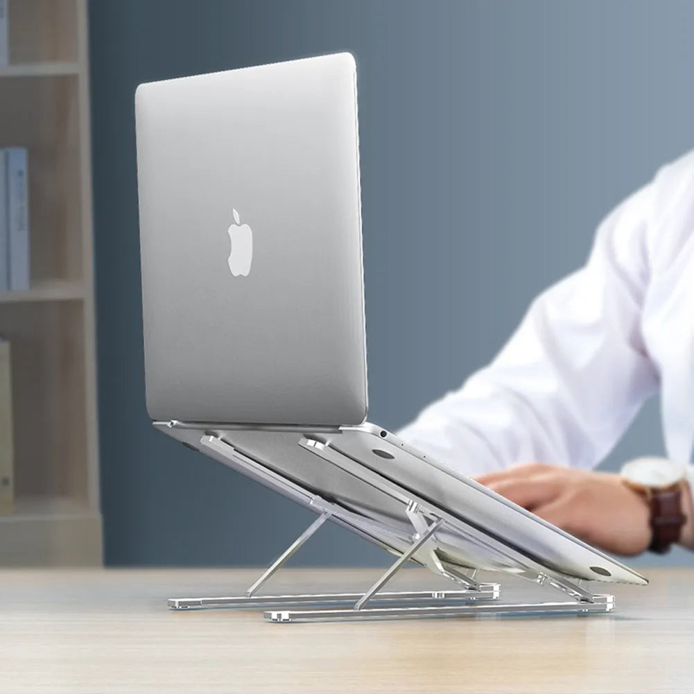 Portable foldable aluminum laptop stand shown in silver colour at an adjustable angle