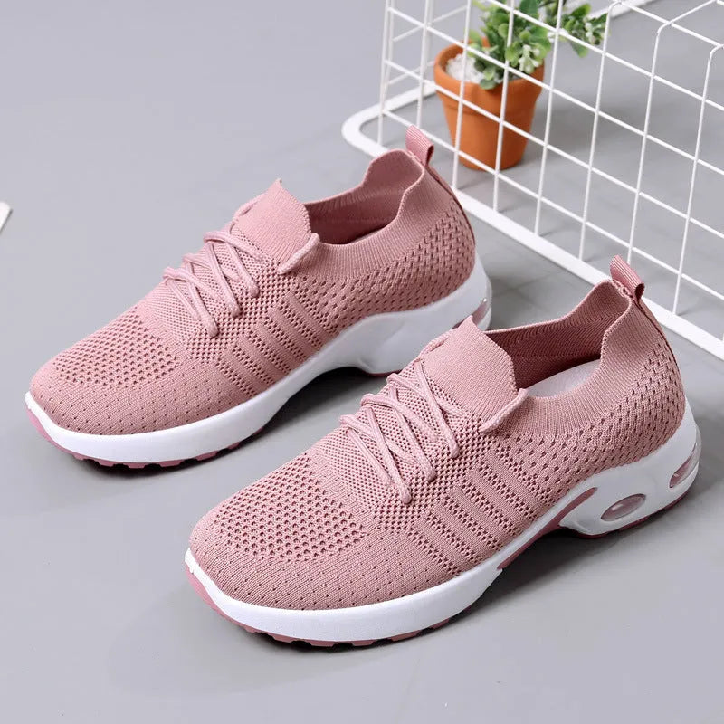 Women's solid colour mesh sneakers with round toe and white lace-up front on a grey non-slip PVC sole.