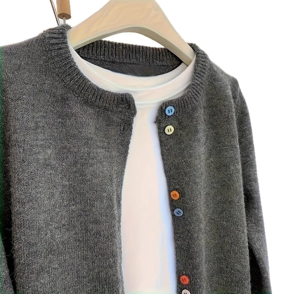 Dark grey women's button-front polyester cardigan on a hanger.