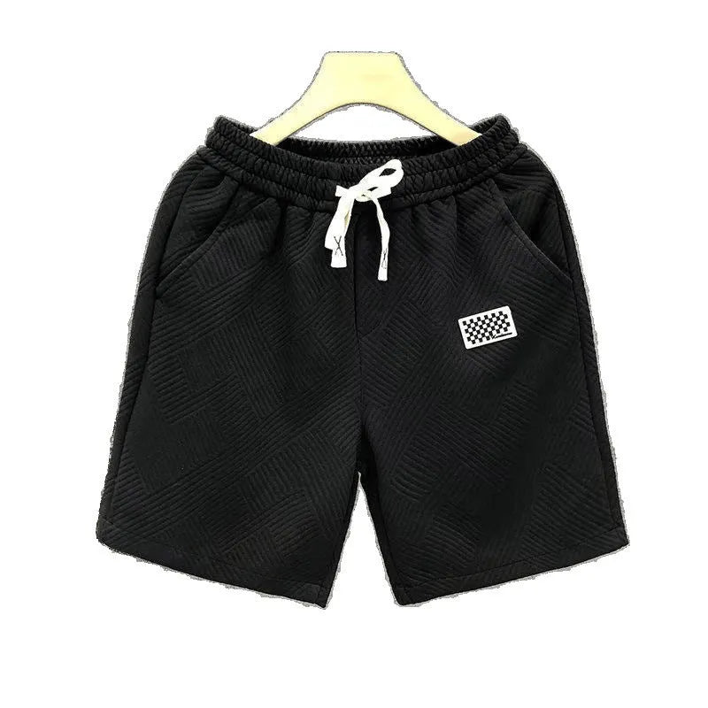 Men's solid colour polyester casual sports shorts with elastic waistband in white, black, or green.