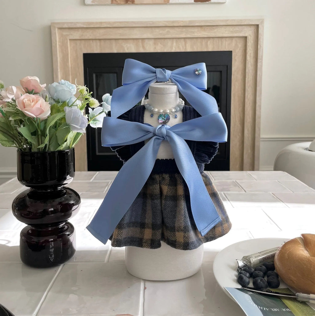 Adjustable princess style dog hair band with bow tension on small dog