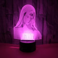 3D LED kids night light with colourful ring pattern, USB cable, and touch-sensitive base on a table.