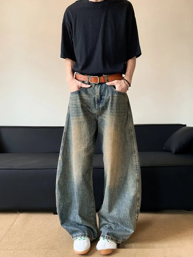 Men's retro blue distressed denim wide-leg pants with vintage styling and slimming silhouette