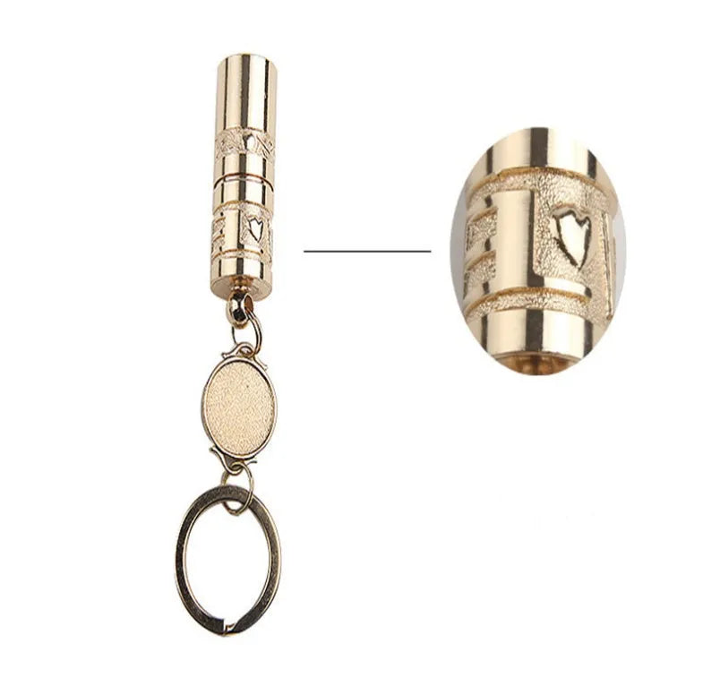 Gold-coloured waterproof mini LED flashlight on a keychain ring.