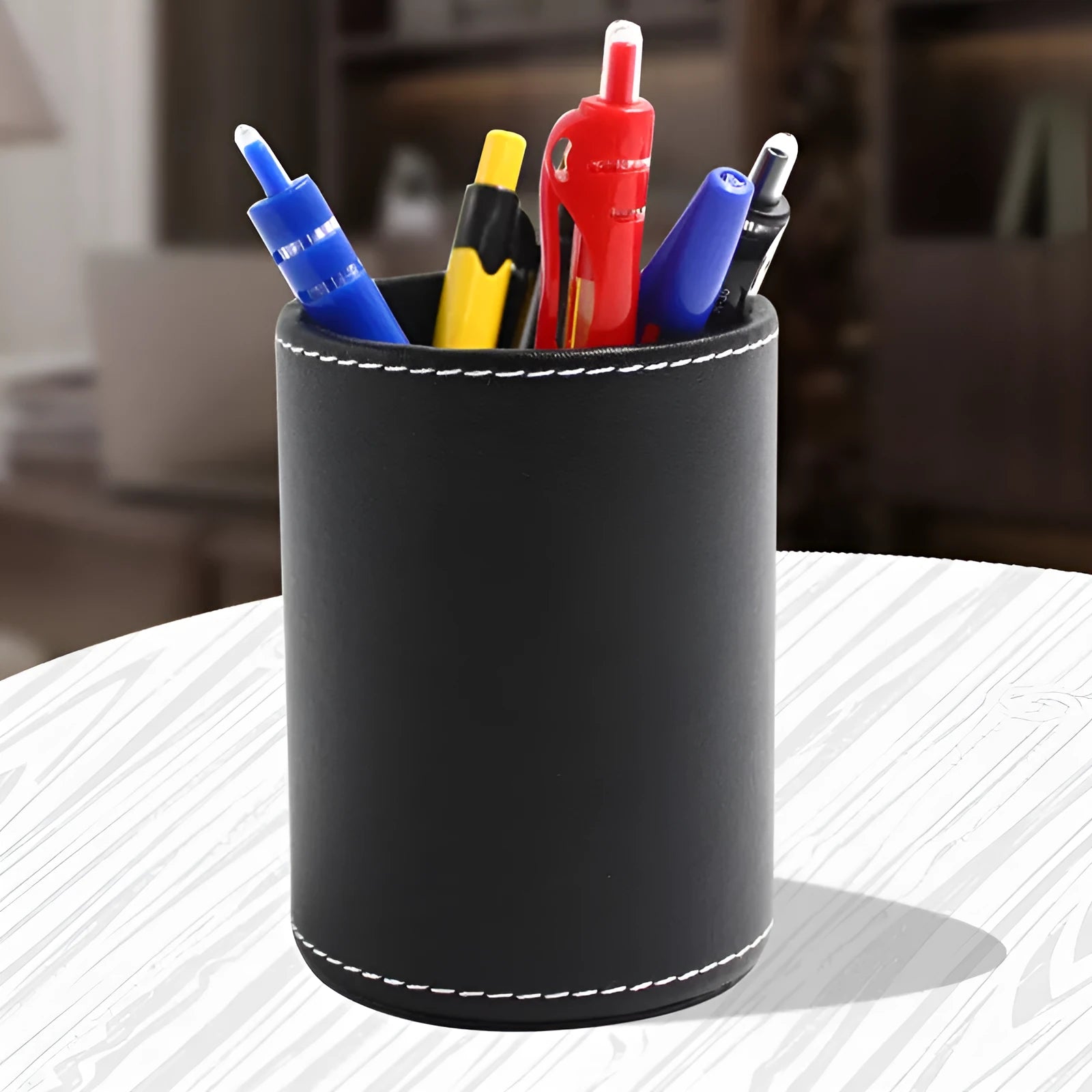 Round black leather pen container showing diameter and height measurements