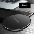 Black square ultra-thin wireless fast charger with USB cable on a desk