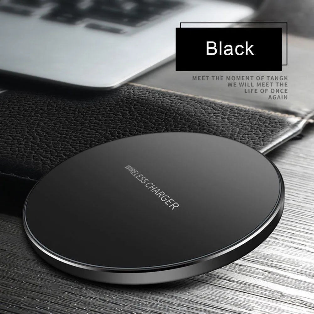 Black square ultra-thin wireless fast charger with USB cable on a desk