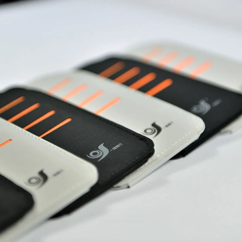 Set of four grey car sun visor panels next to a fabric storage pouch on a car dashboard.