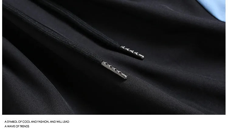 Men's black and grey quick-drying sports shorts with elastic waist and contrast colour panels for training