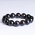 Polished natural crystal Pi Xiu bracelet with ethnic geometric design on a wrist