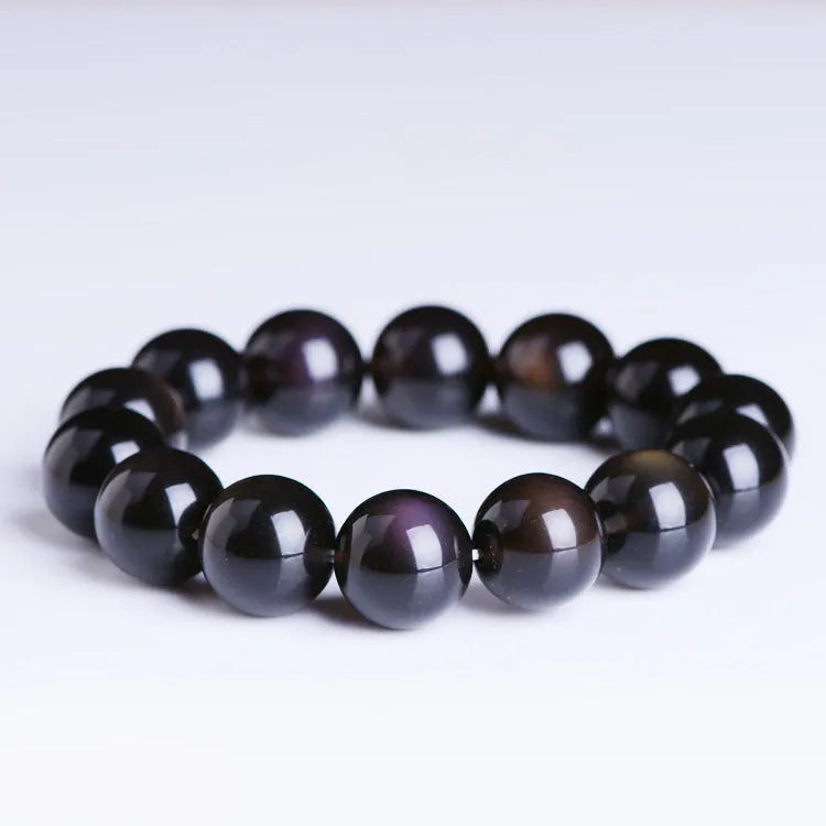 Polished natural crystal Pi Xiu bracelet with ethnic geometric design on a wrist