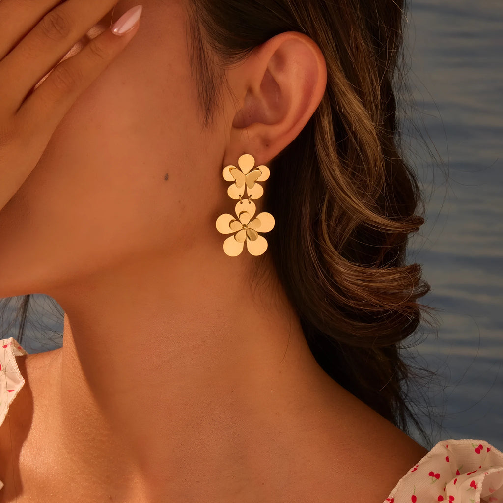 Women's stainless steel earrings with 18K gold electroplated flower butterfly design and post backs