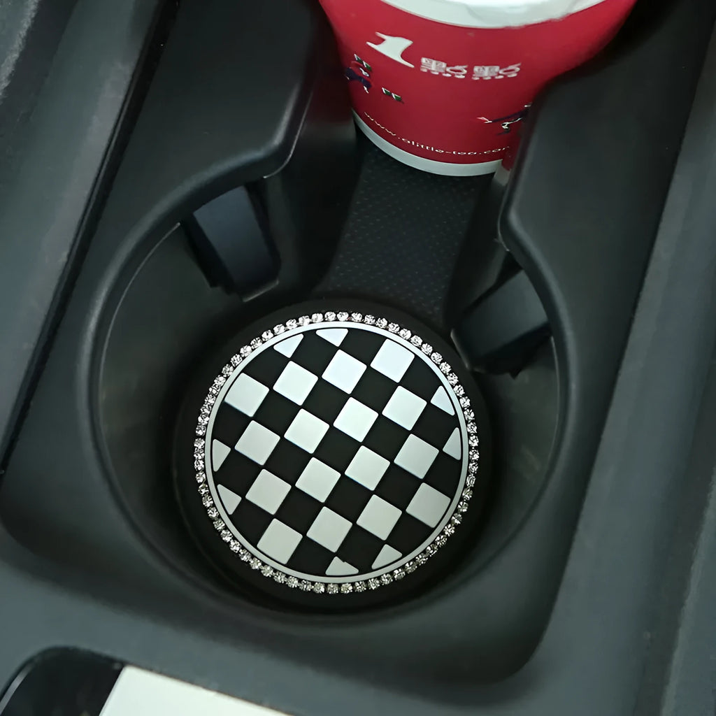 Black and white checkerboard PVC non-slip car water cup mat on a cup holder