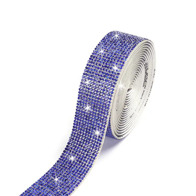 Long glass strip with self-adhesive backing for clothing decoration, shown in white and AB colour.