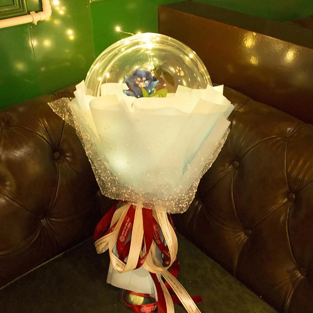 Transparent LED balloon rose bouquet with pink artificial flower and glowing light on dark background