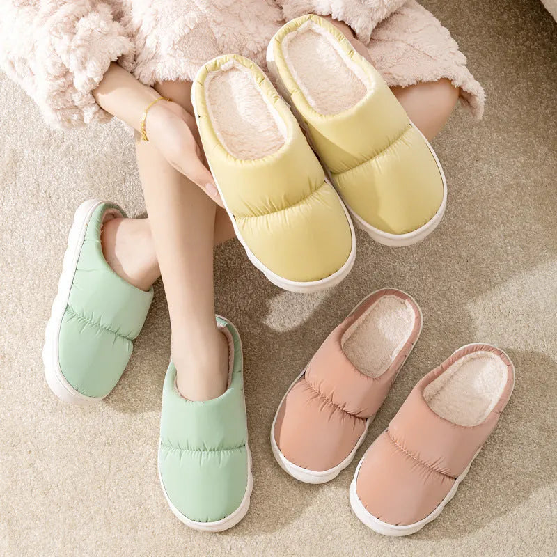 Pair of down cotton winter slippers with a thick rubber non-slip sole, shown in a choice of colours.