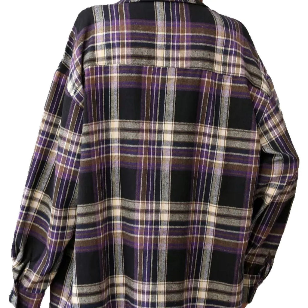 Women's loose fit black and green plaid cotton shirt with long sleeves on a hanger.