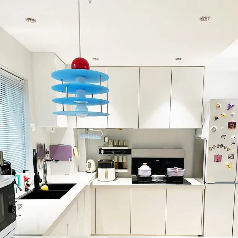 Macaron-shaped pendant chandelier with frosted finish in restaurant setting