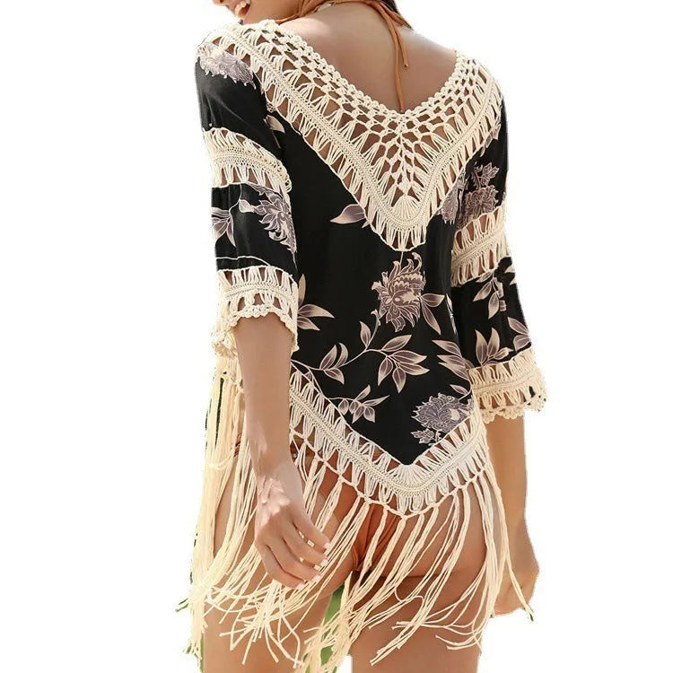 Women's apricot-coloured sun protection blouse with V-neck and hollow-out sleeves on a hanger