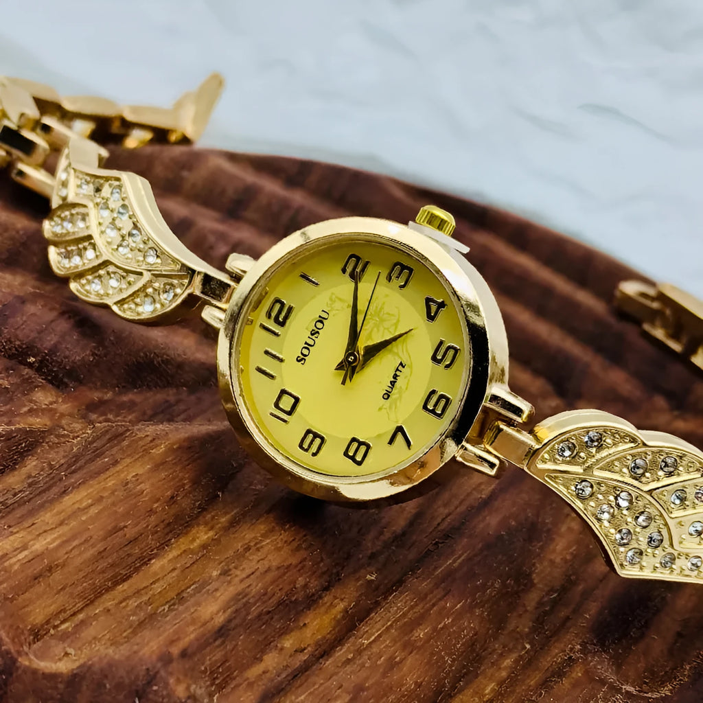 Stainless steel women's watch with round dial and vachette clasp, shown in gold, black, and white colour options.