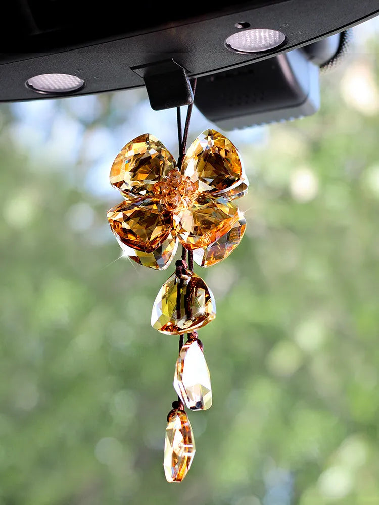 Crystal four leaf grass car pendant measuring around 20cm in transparent, champagne, translucent black finishes