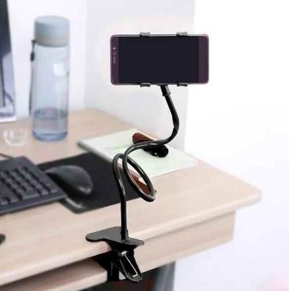Black flexible long arm phone holder clipped to bed frame with smartphone mounted at adjustable angle