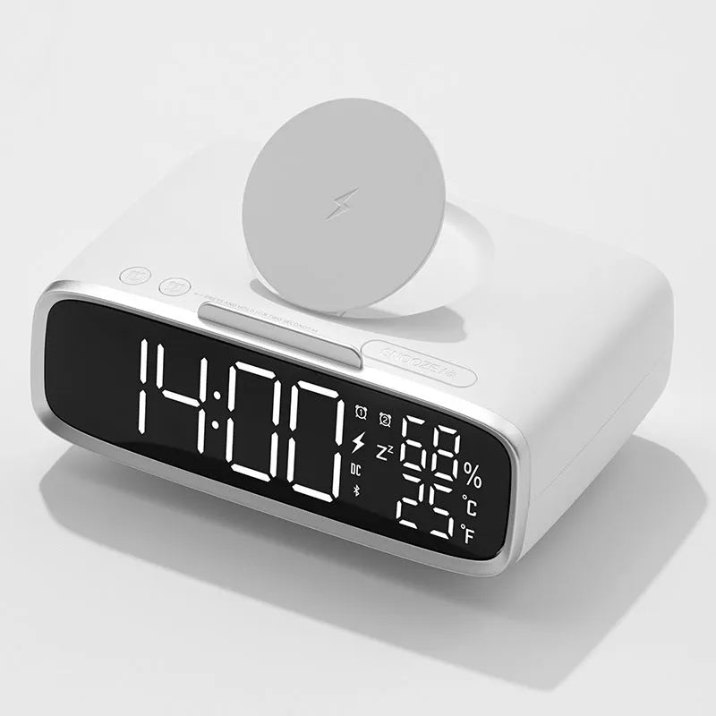 White ABS acrylic Bluetooth speaker wireless charger with night lamp and alarm clock on a desk showing charging pad and speaker grille