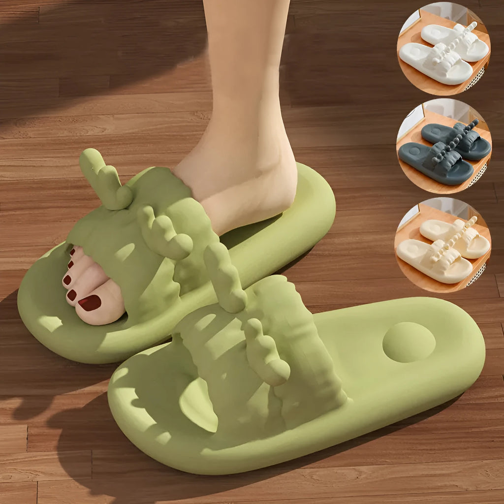 Women's light yellow EVA flip flop slippers with deer horn design and hollow-out upper on a plain background.