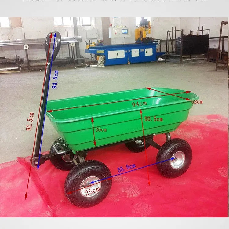 Green four-wheel plastic dump truck with steel frame and tipping bed for agricultural use.